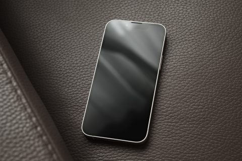 iPhone 13 mini on leather